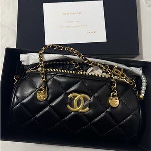 CHANEL Black Quilted Clutch with Gold Accents